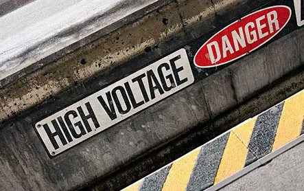A warning label that says "High Voltage, Danger".