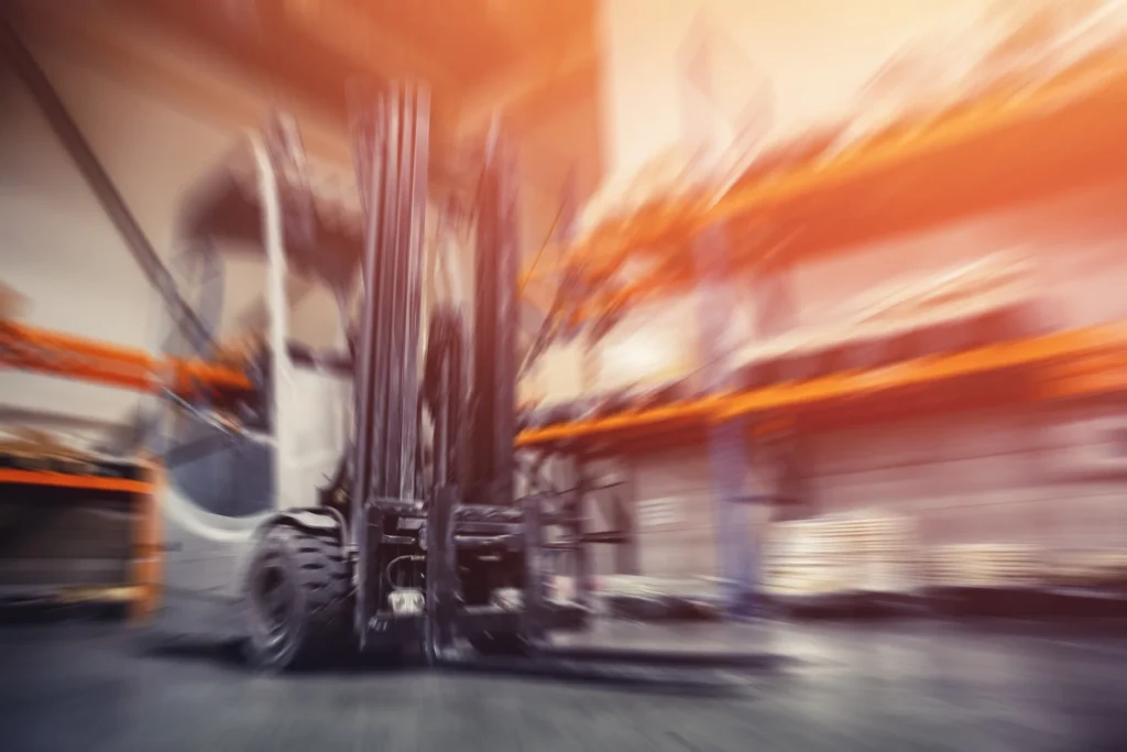 A blurred image of a forklift.