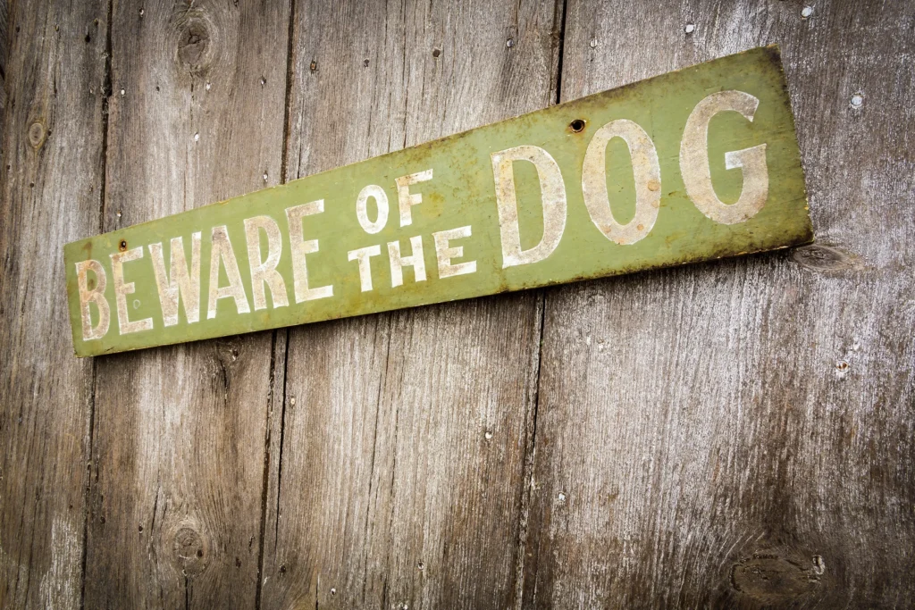 Beware of dog sign to warn against an aggressive dog.