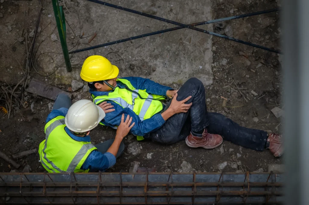 An injured worker on the floor.