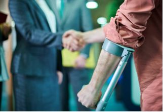 Man with crutch shaking hands.